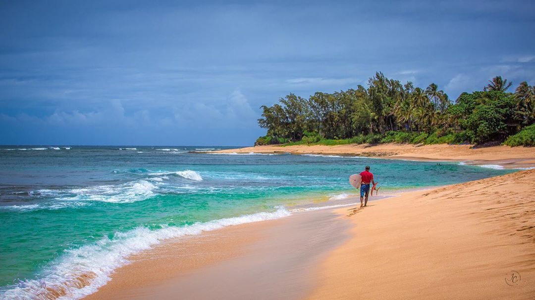 Wide sand and winter surf at Sunset Beach