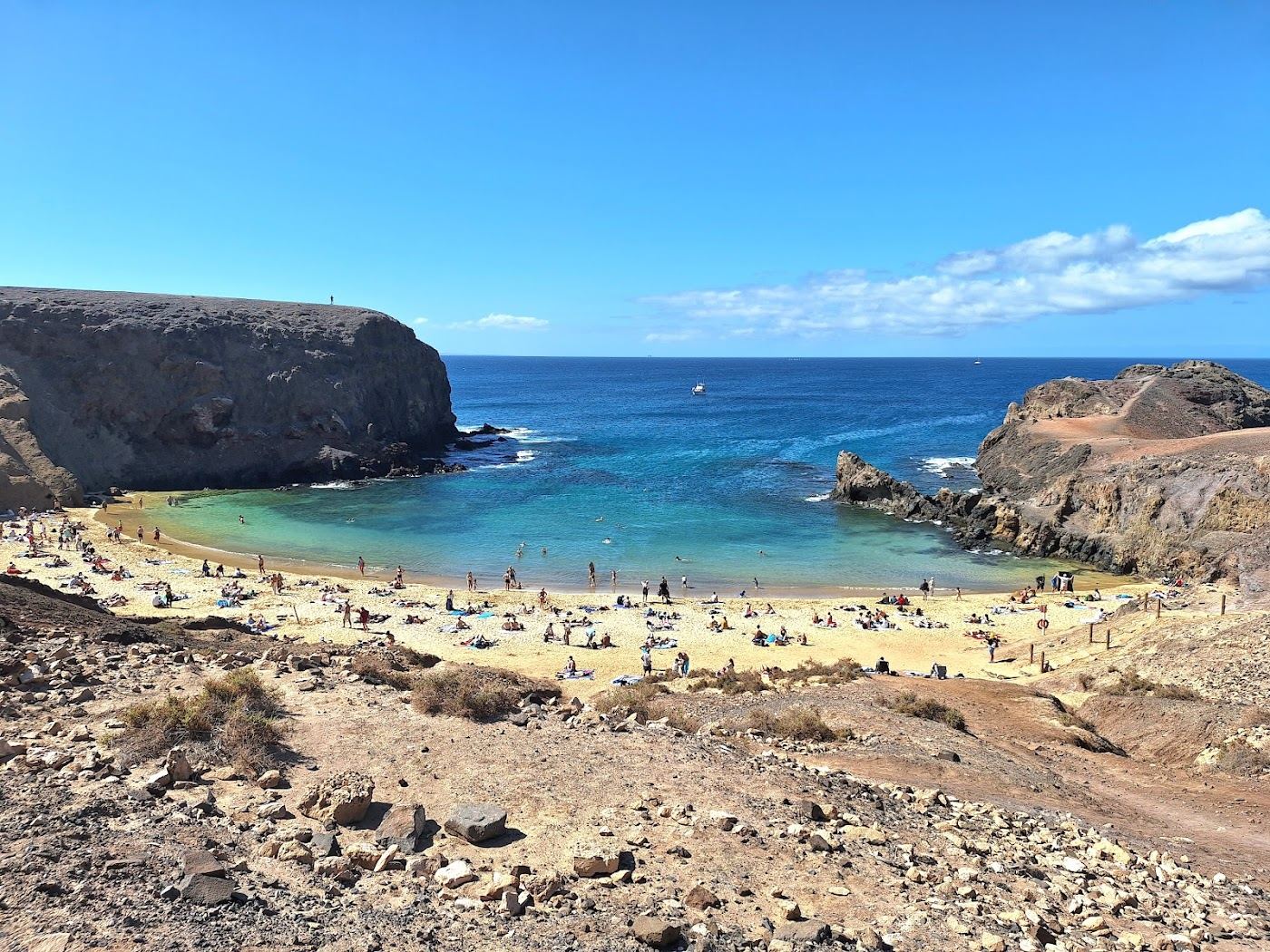 Calm golden cove and clear turquoise water at Playa de Papagayo in southern Lanzarote