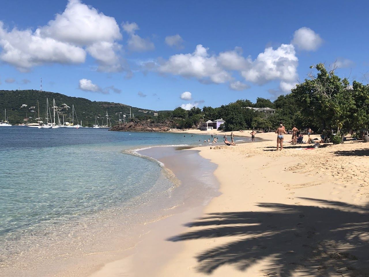 The gently sloping golden sand and calm bay of Pigeon Point Beach near English Harbour Antigua