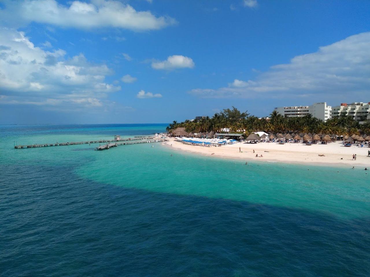 Calm shallow turquoise water and white sand at Playa Norte on Isla Mujeres