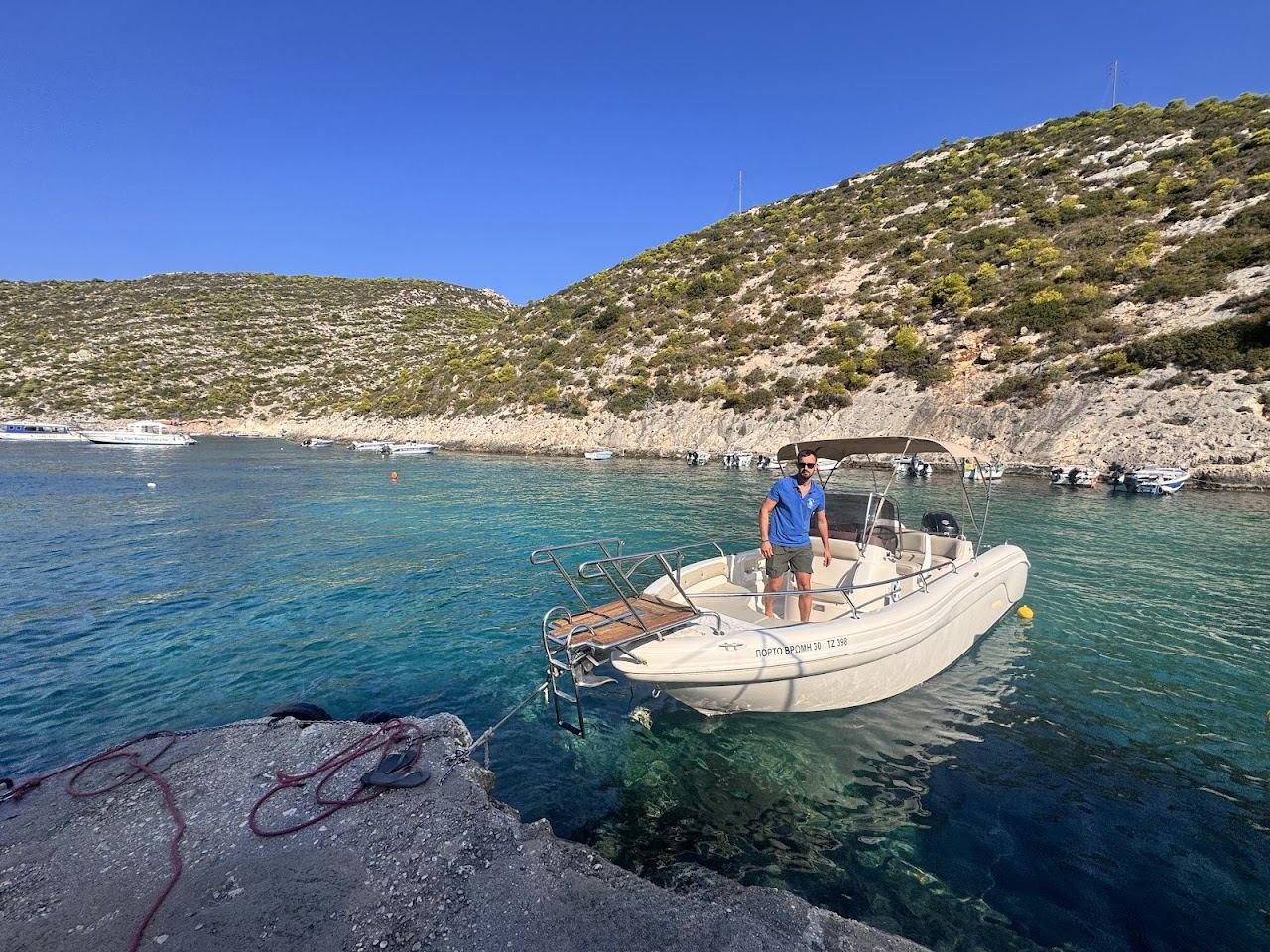 The small quiet rocky cove and clear turquoise water of Porto Vromi on the wild west coast of Zakynthos