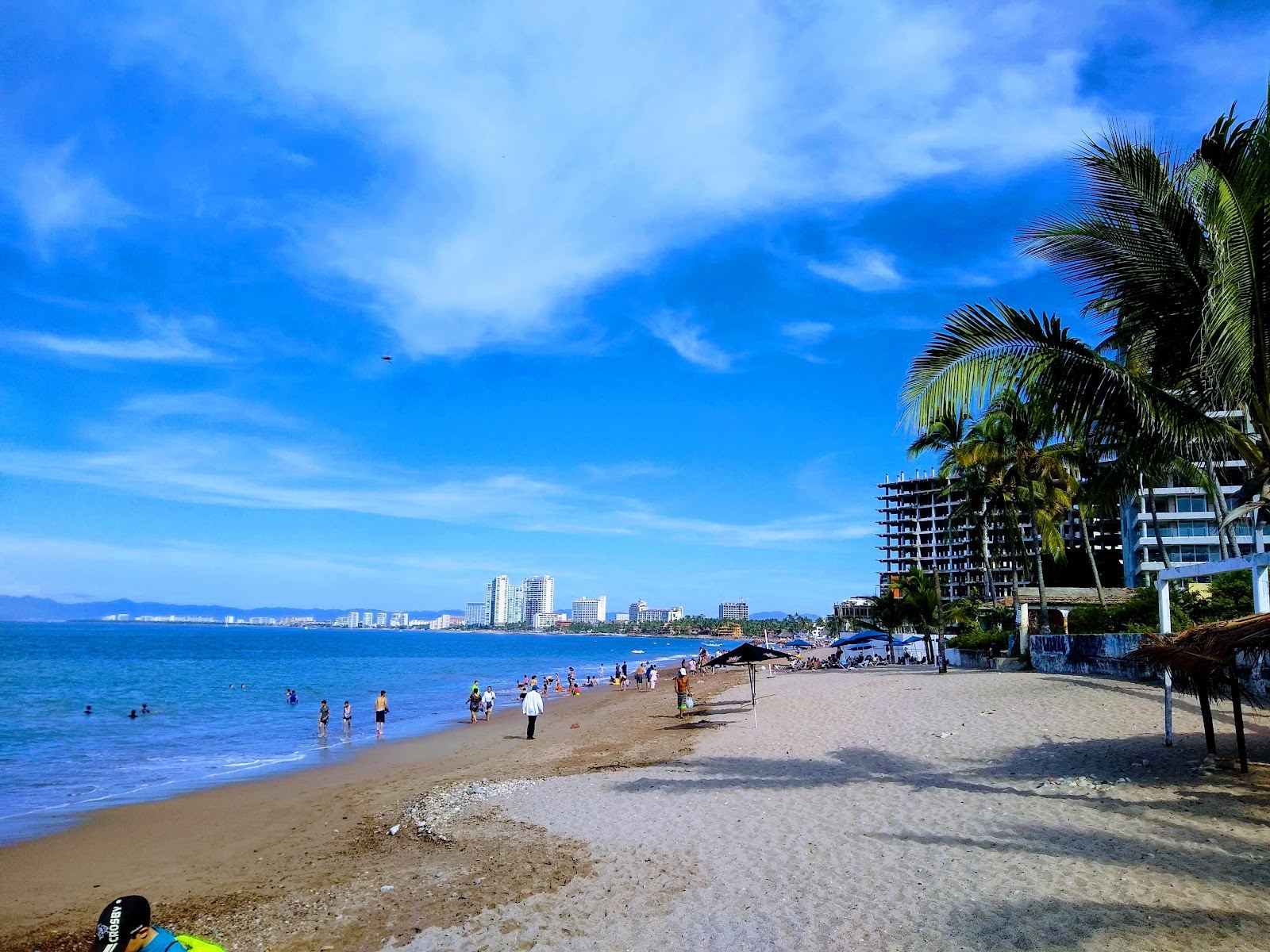 Golden sand and gentle Banderas Bay water at Playa Camarones on the Puerto Vallarta Malecon