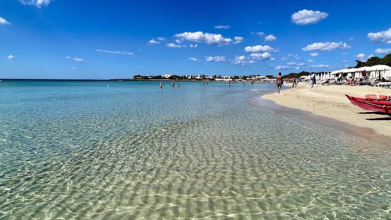 Shallow turquoise flats and white sand at Punta Prosciutto near Porto Cesareo on the windy Ionian coast of Puglia