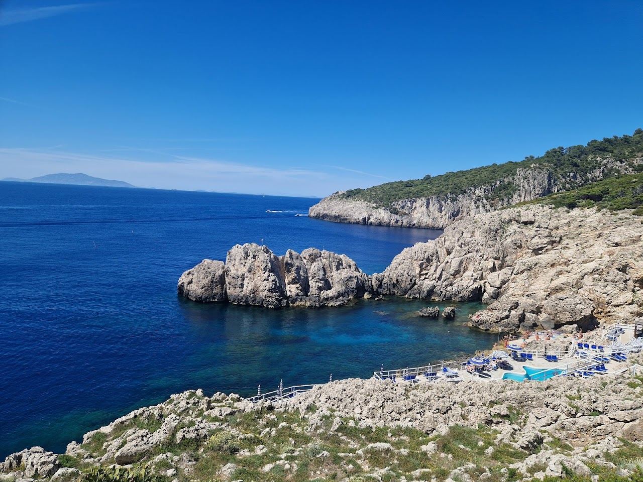 Sun terrace and saltwater pool at Lido del Faro below the lighthouse at Punta Carena in Capri