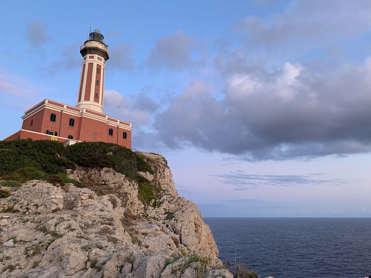 Flat rocks and swimming platforms below the Punta Carena lighthouse in Capri
