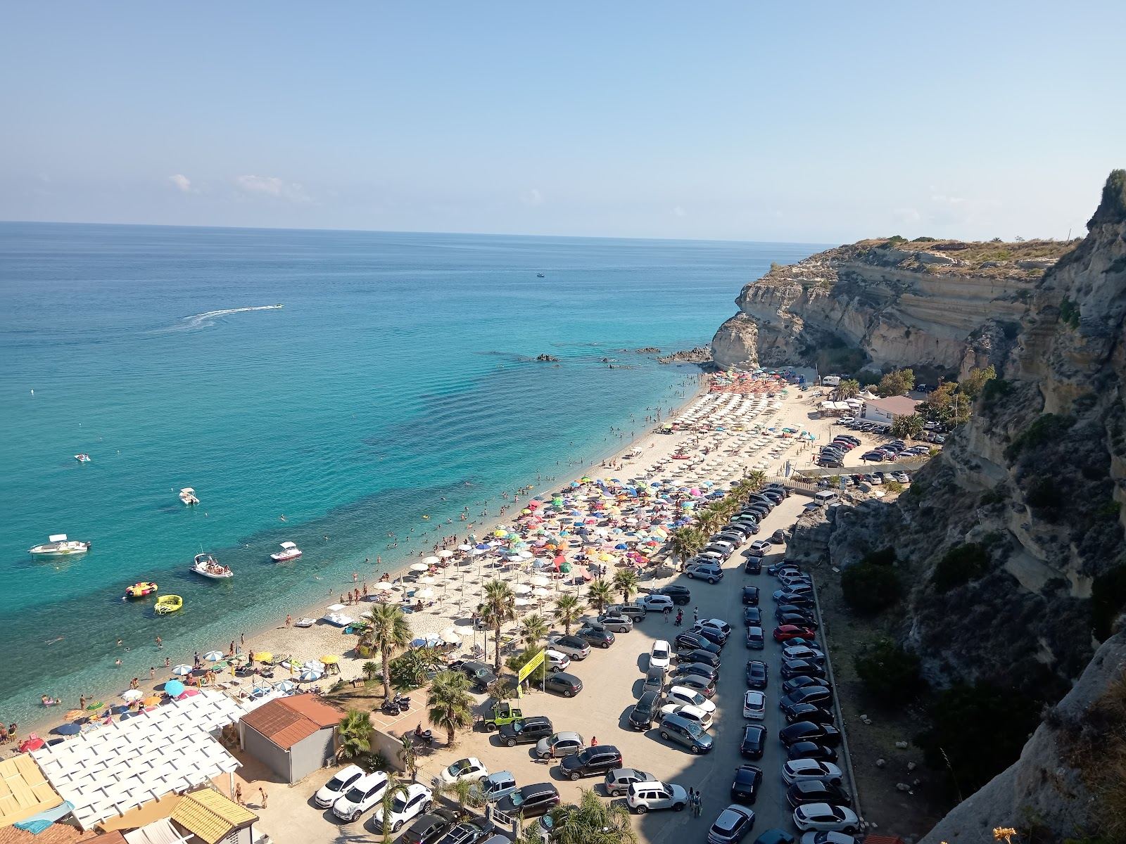 Sandstone rock stacks and clear turquoise water at Riaci beach near Capo Vaticano in Calabria