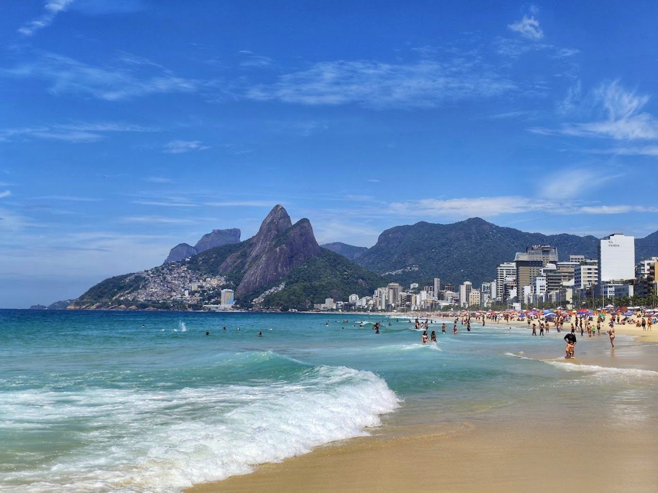 The stylish crescent of Ipanema Beach with the Two Brothers mountain in Rio de Janeiro