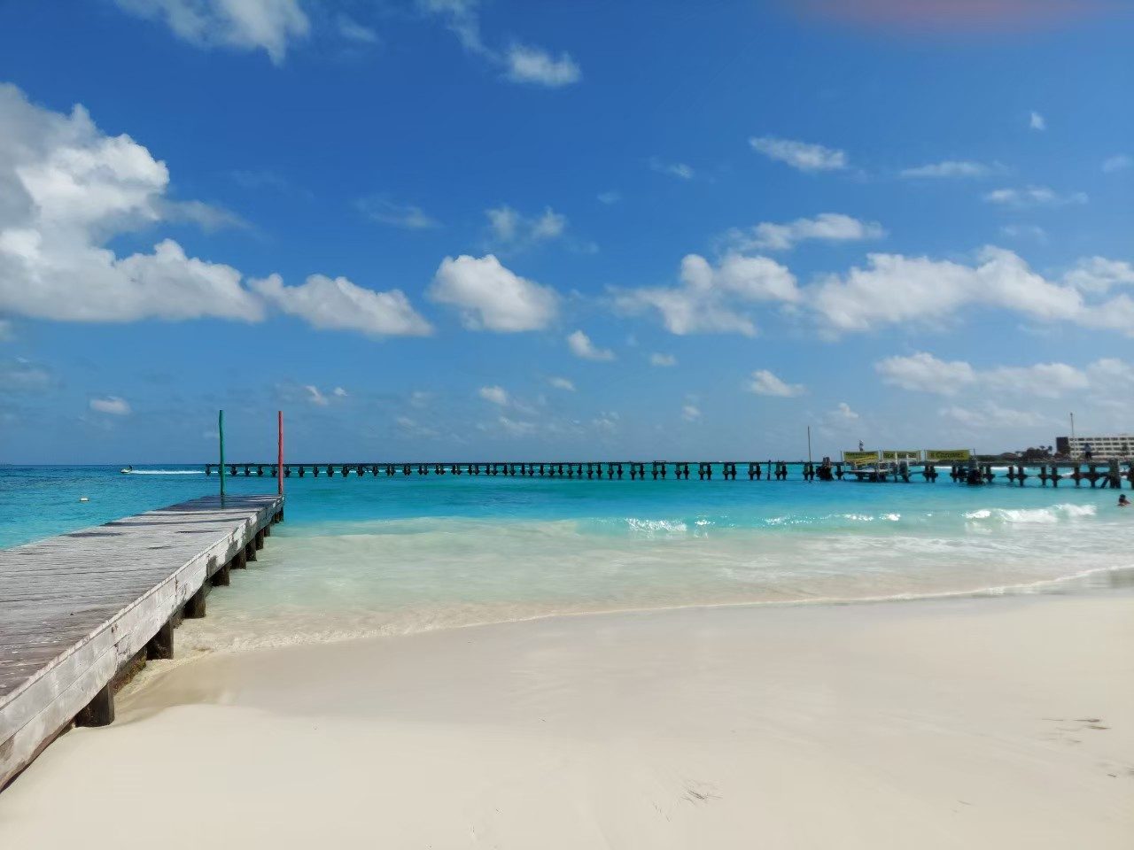 Flat clear shallows over pale sand on a sheltered Riviera Maya beach in Mexico