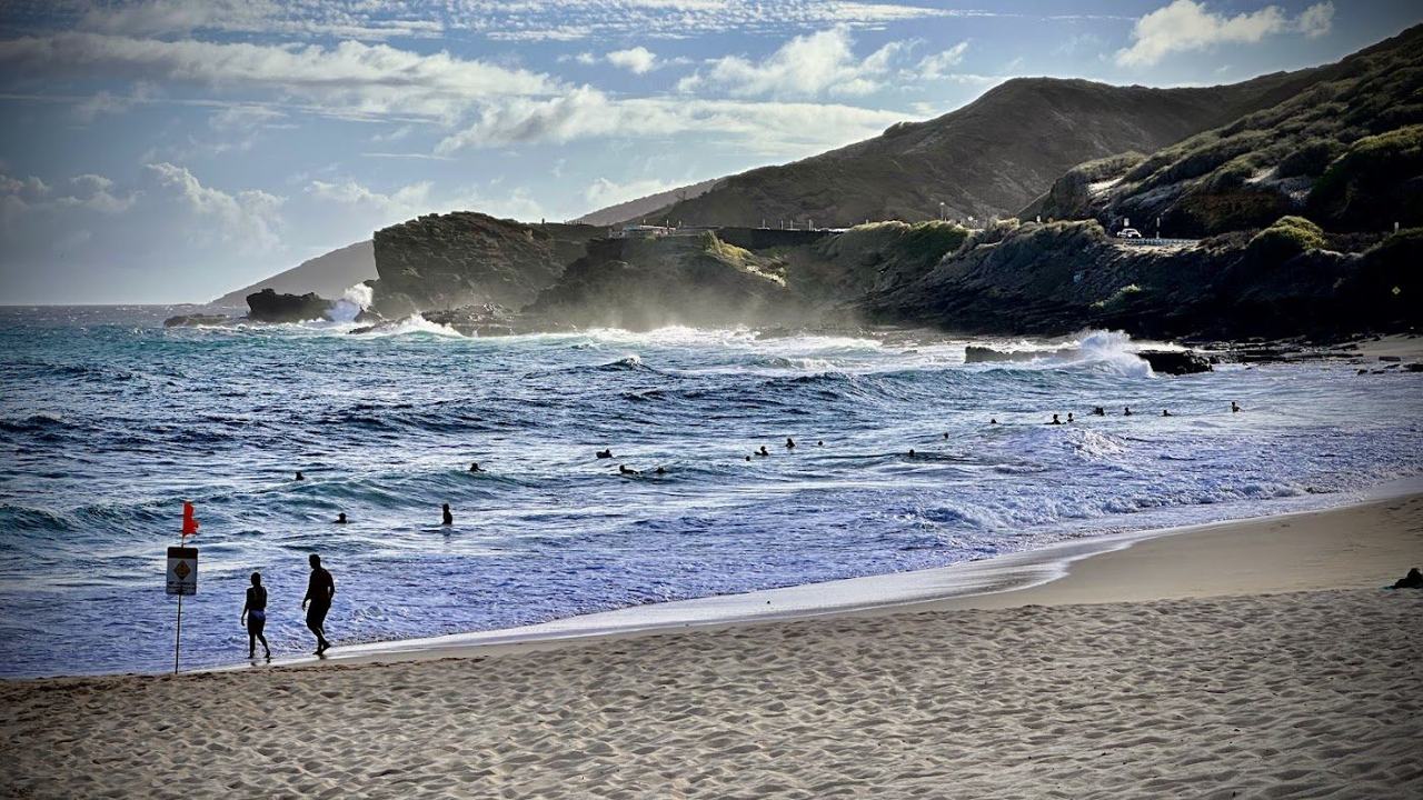 The powerful shorebreak and golden sand at Sandy Beach in southeast Oahu