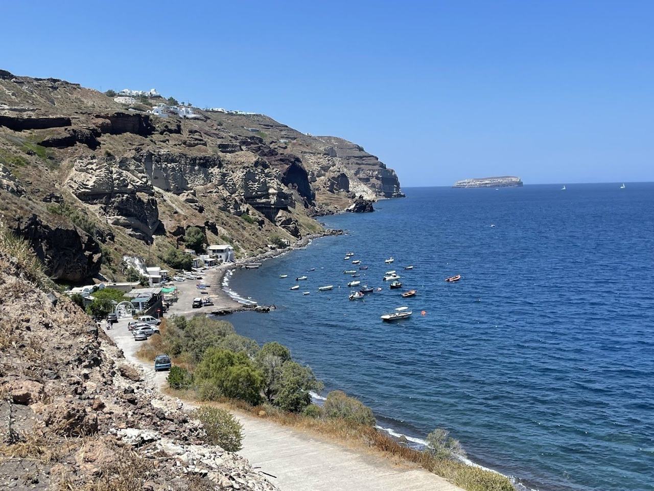 Calm sheltered shallow water at Caldera Beach near Akrotiri in Santorini