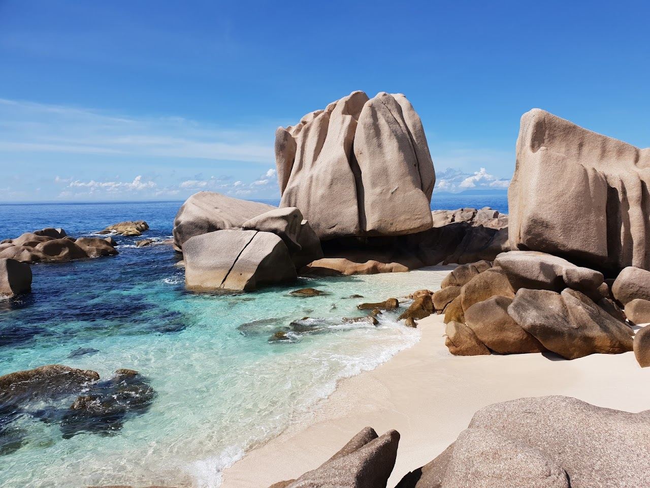 Sculpted granite boulders around the clear rock pools of Anse Marron on La Digue