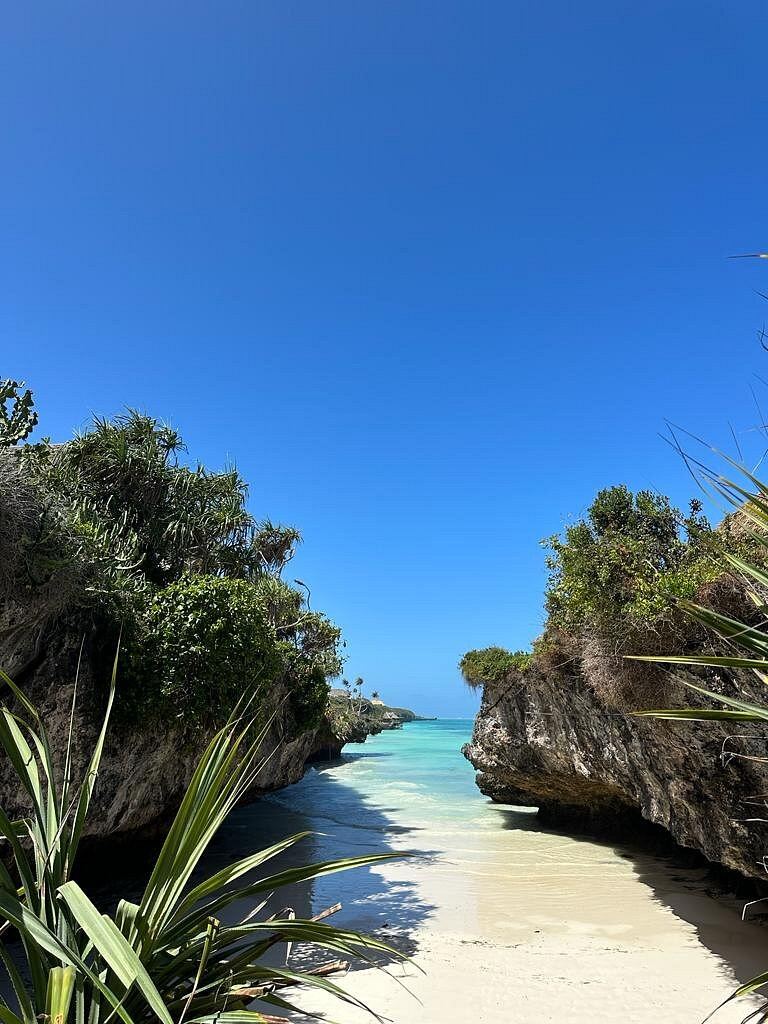 The small cliff framed cove and rock pools at Mtende on southern Zanzibar