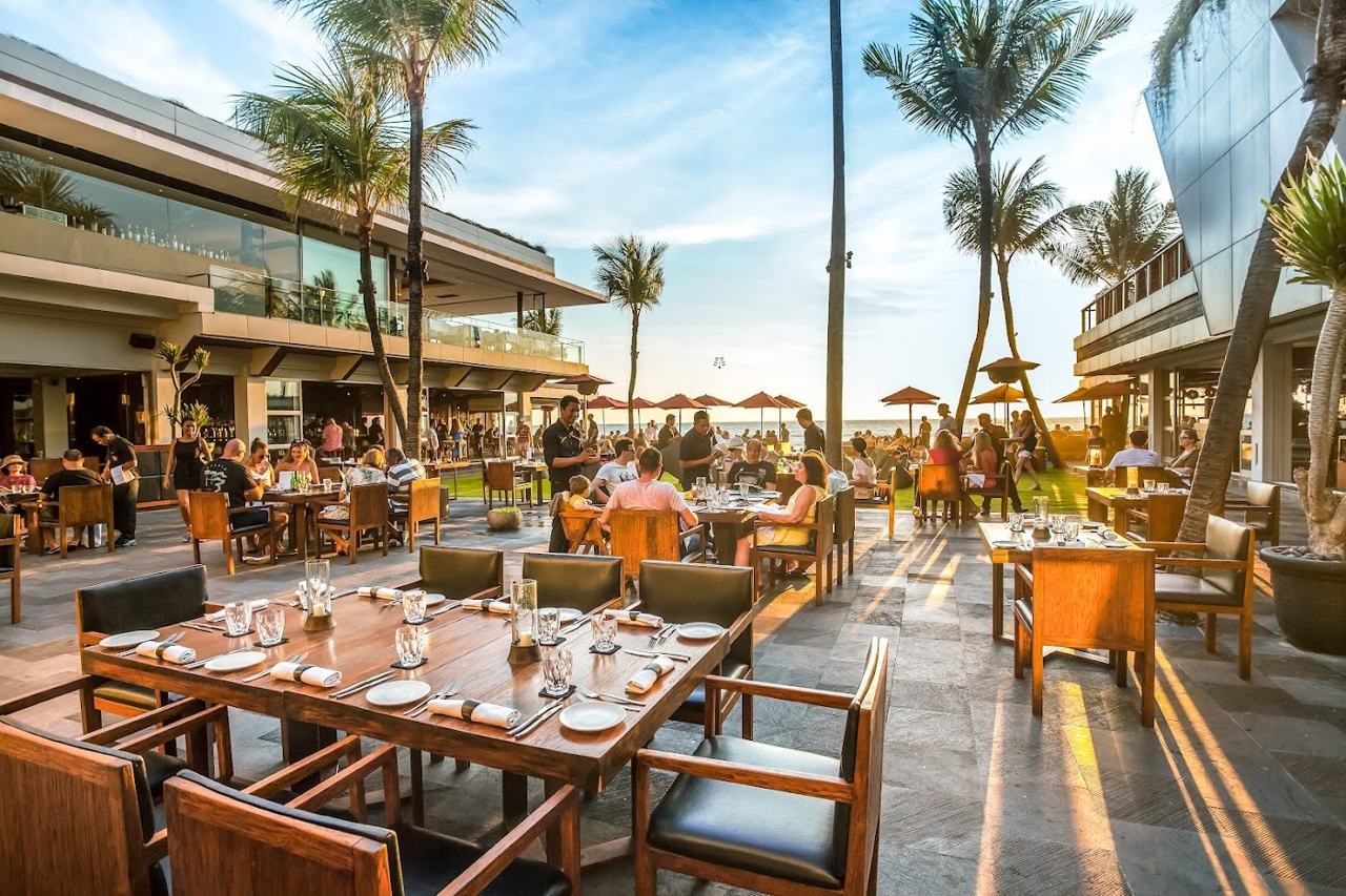 Sunset loungers facing the sea at Ku De Ta in Seminyak