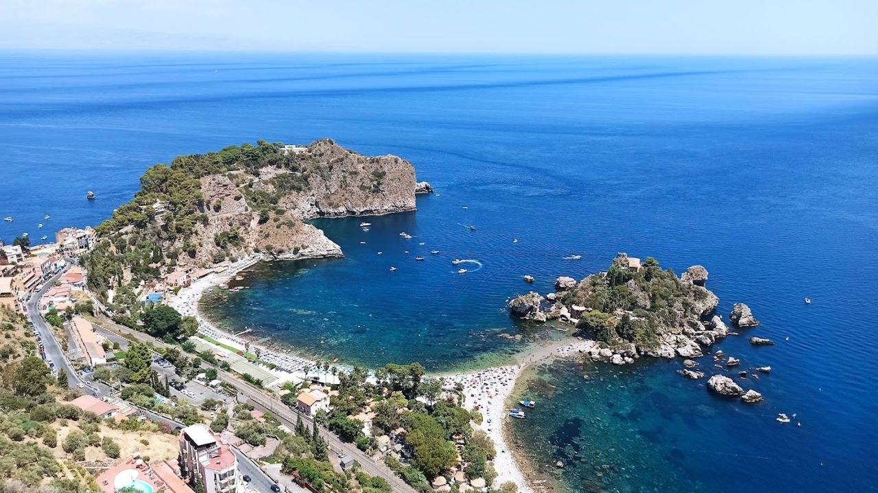 The islet and clear water at Isola Bella below Taormina, Sicily