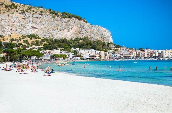 The wide bay and clear water at Mondello near Palermo, Sicily, a popular windsurfing beach
