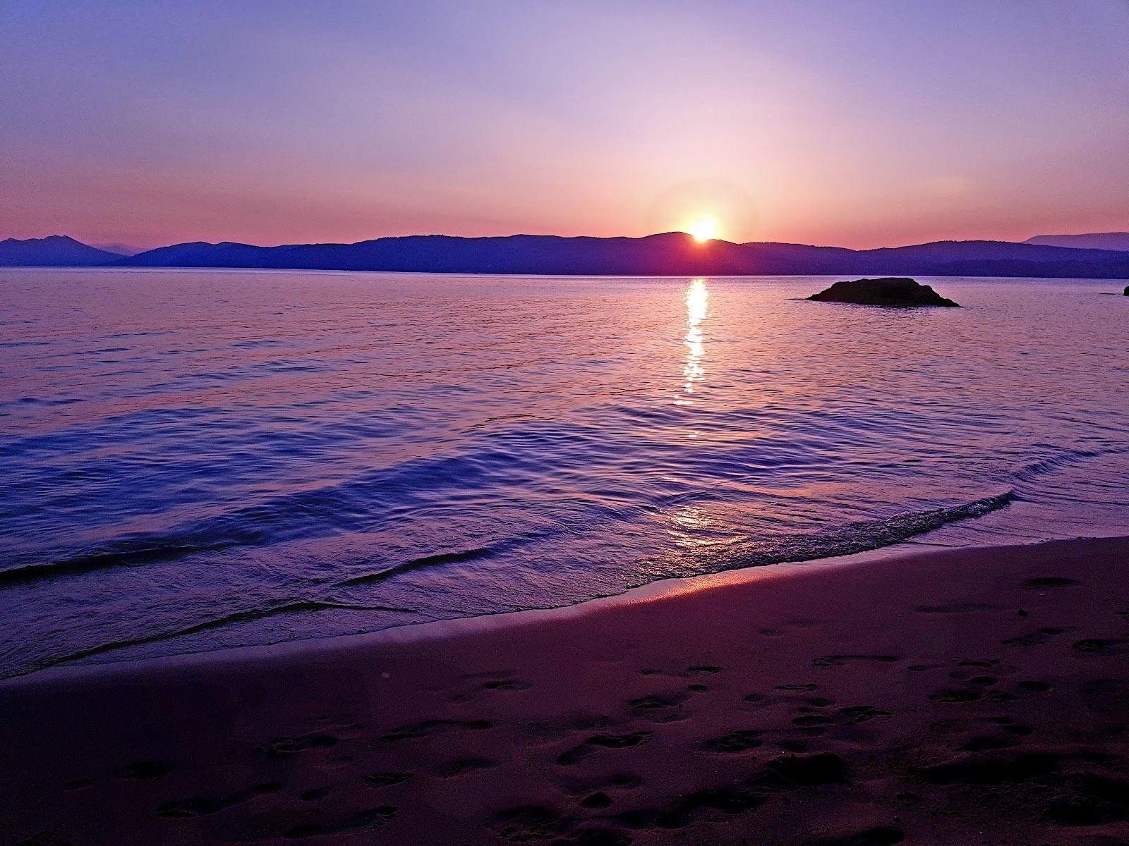 The small sheltered cove of Little Banana on Skiathos, home sand of Black Bird Beach Bar