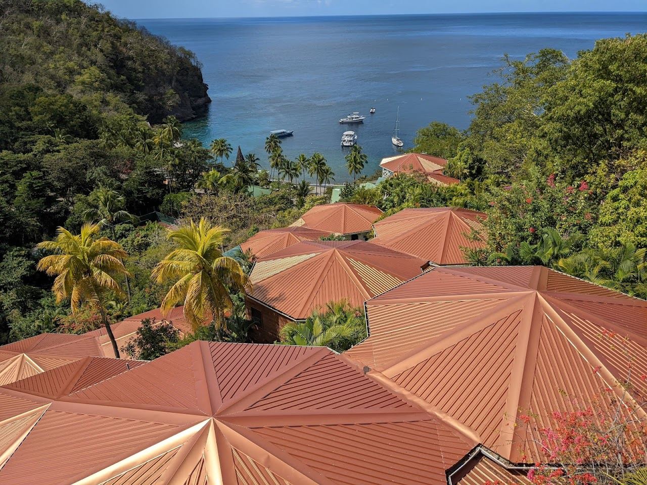 Romantic cove with calm water and the green Pitons beyond near Soufriere in St Lucia used for the couples beaches guide on Beaches for Kings