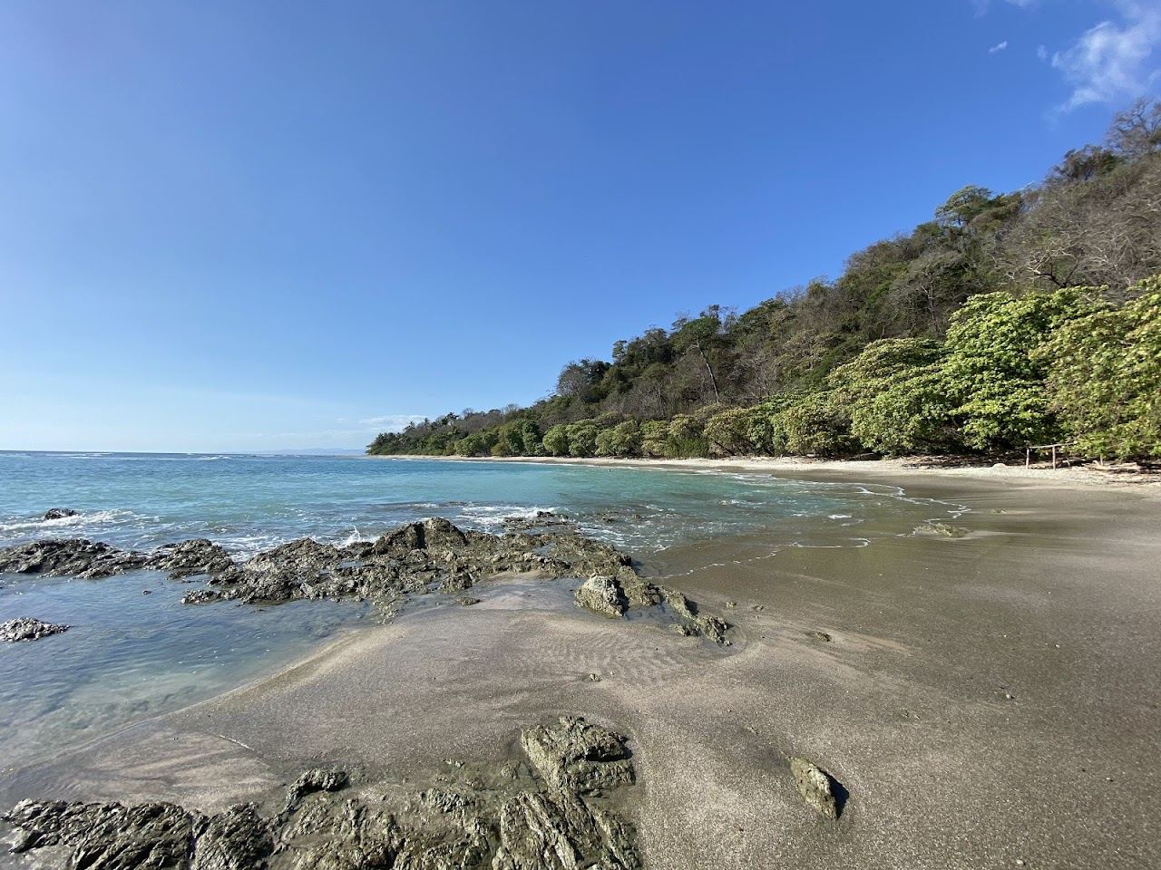 A near empty stretch of quiet fishing beach at Manzanillo near Santa Teresa Costa Rica