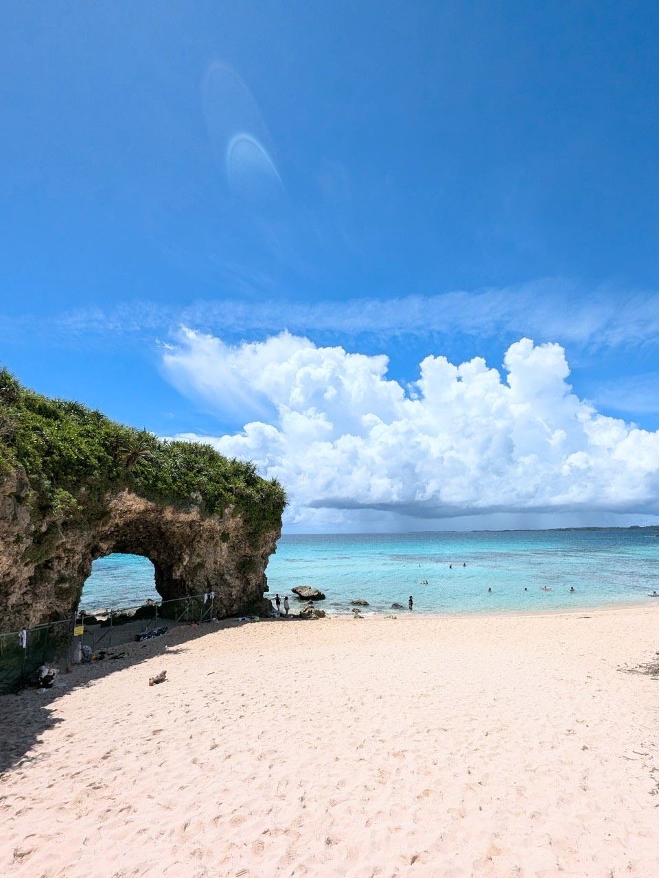 The natural rock arch and white sand cove of Sunayama Beach on Miyako, Okinawa