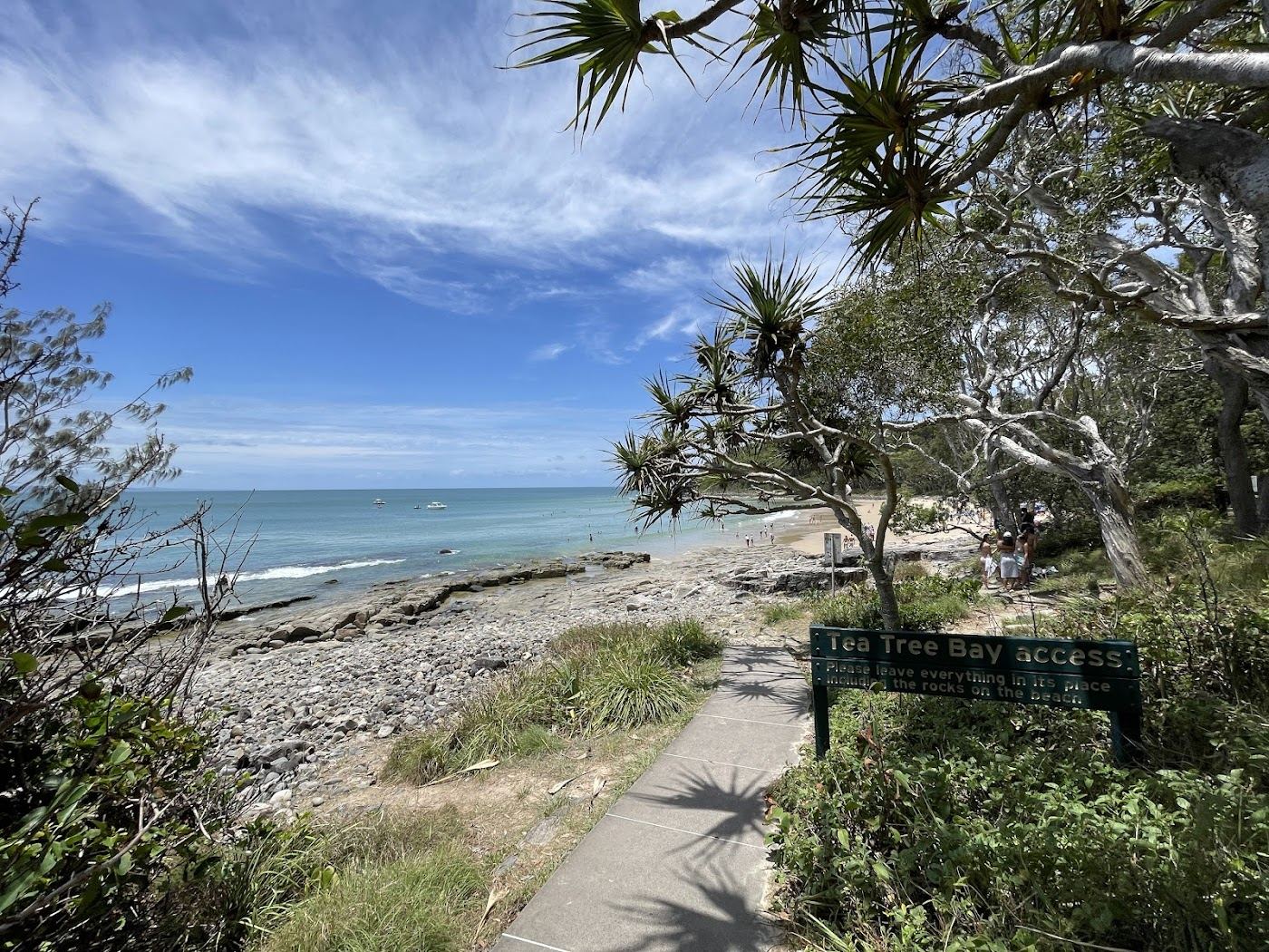 The pandanus fringed cove and clear water of Tea Tree Bay along the Noosa coastal walk
