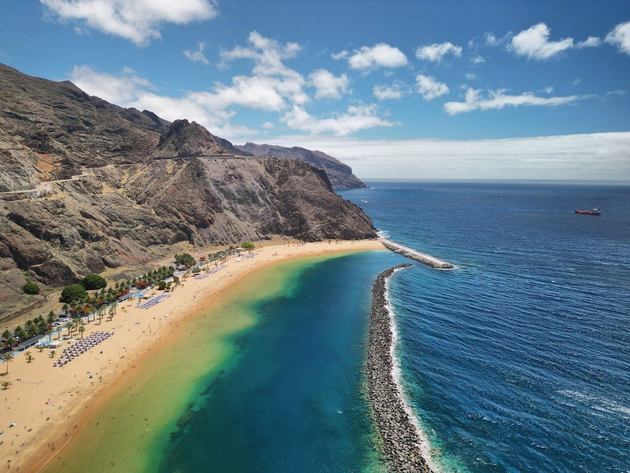 The golden imported sand and sheltered water of Playa de las Teresitas in Tenerife