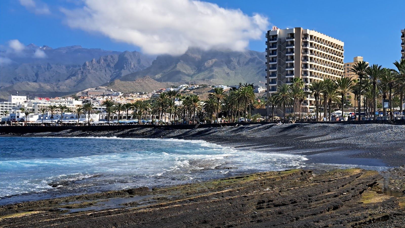 The long resort sand and seafront of Playa de las Americas on the south coast of Tenerife