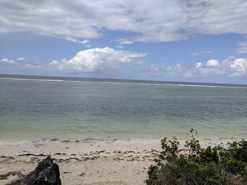 Soft white sand and shallow reef water at Tiwi Beach on the Kenya south coast