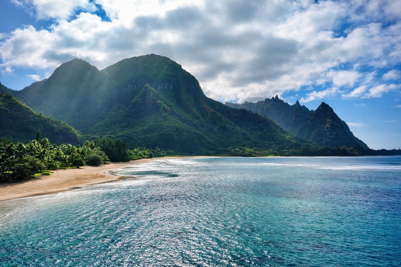 The reef and mountains behind Tunnels Beach on the north shore of Kauai
