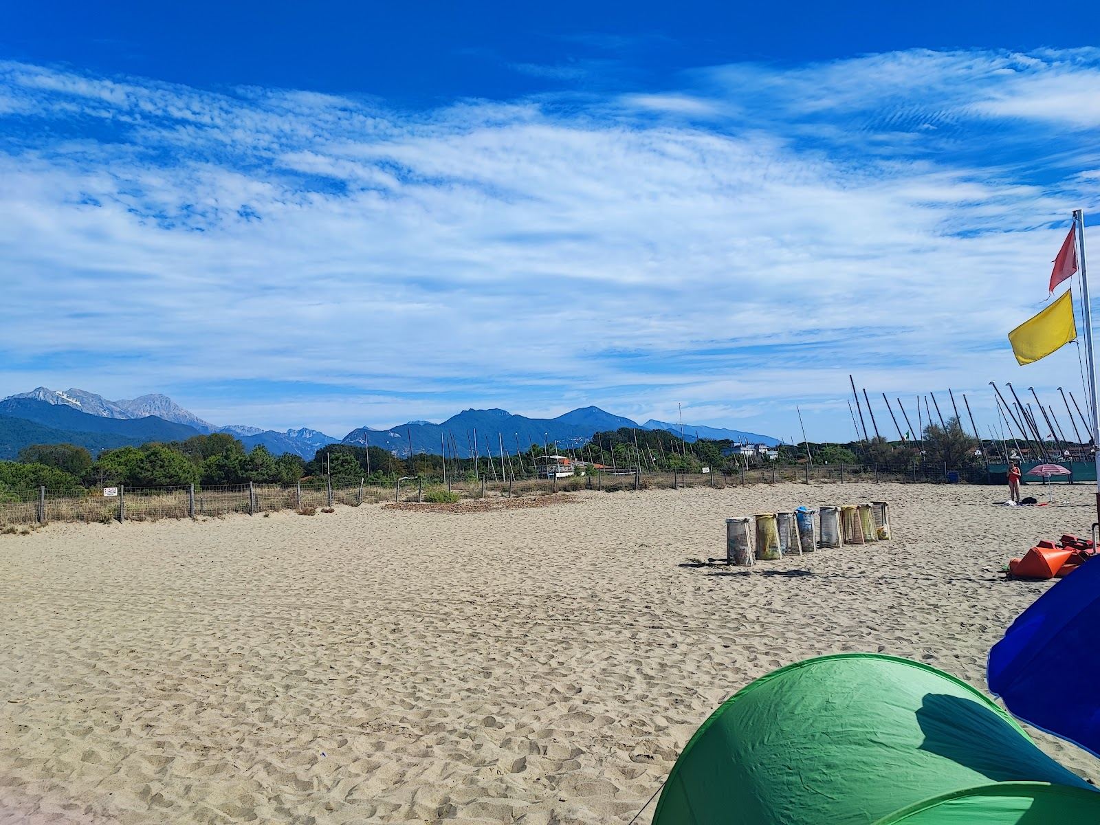 Rows of umbrellas and cabins at a Versilia bagno on the Tuscany coast
