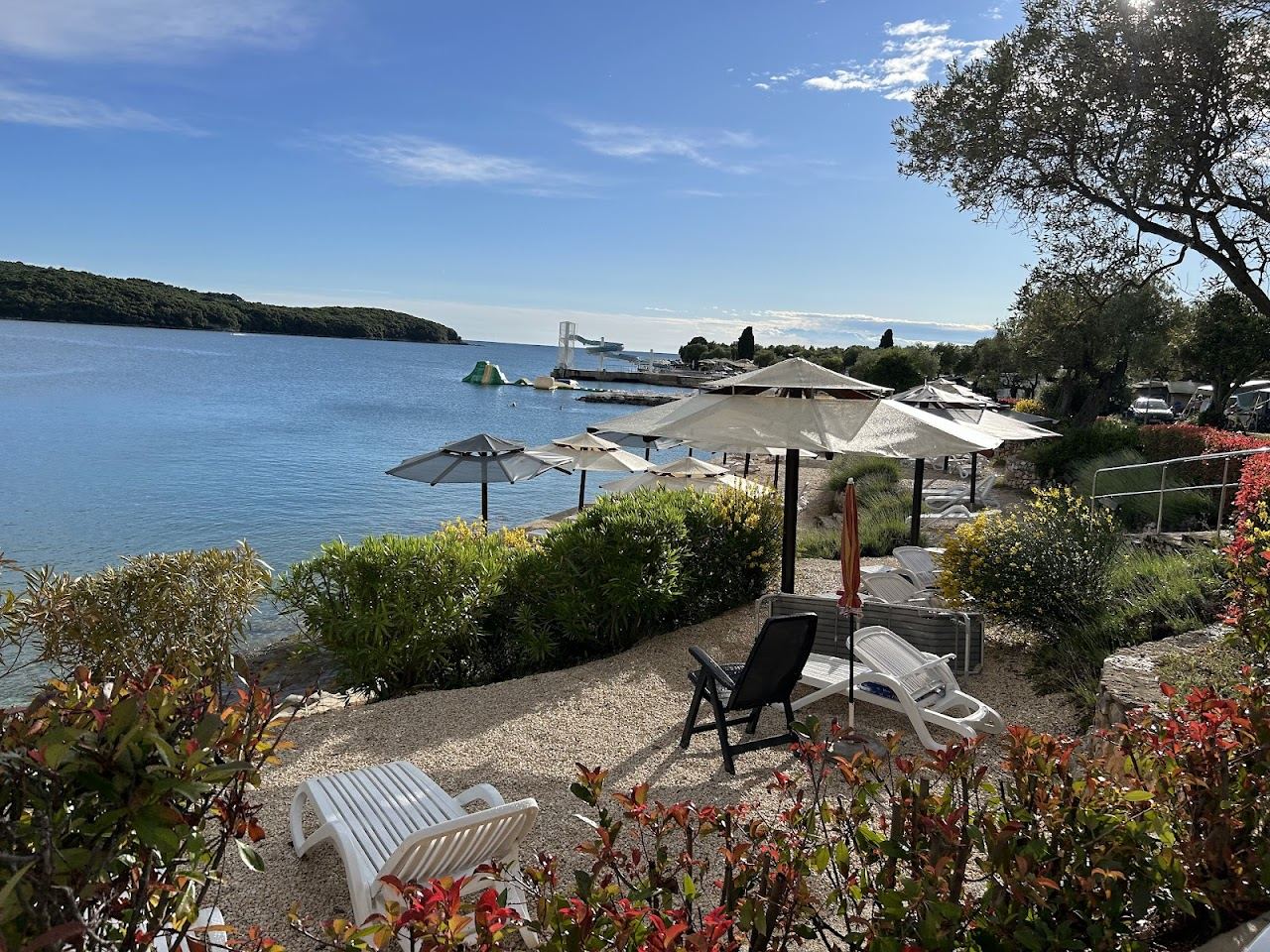 Long pebble naturist beach and clear water at Valalta north of Rovinj in Istria