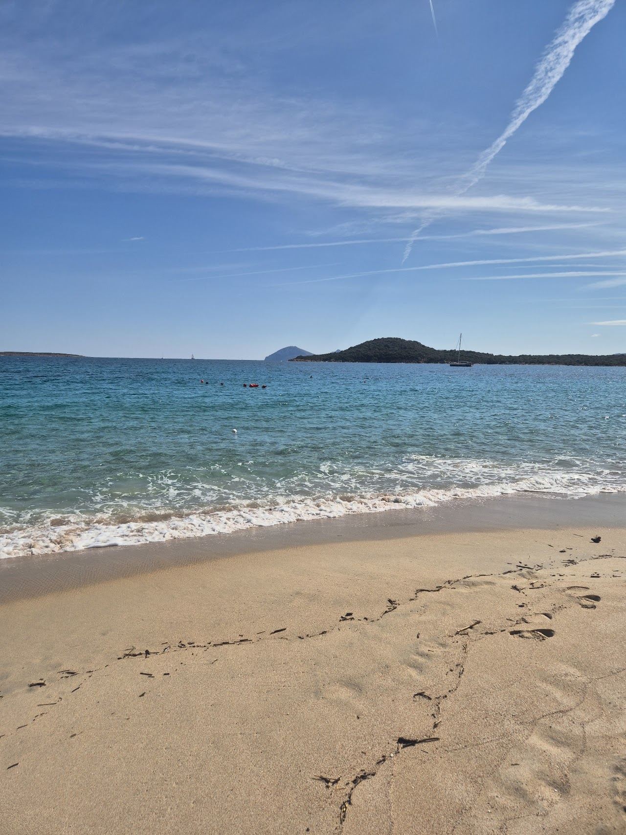 Pale sand and shallow clear water of Liscia Ruja beach on the Costa Smeralda