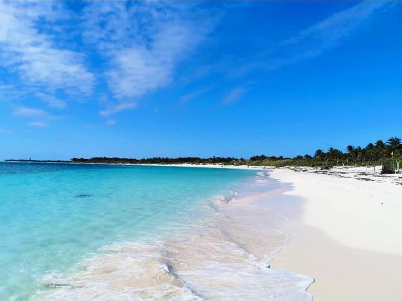 White sand and calm reef sheltered turquoise water at Playa Xcacel turtle sanctuary near Tulum