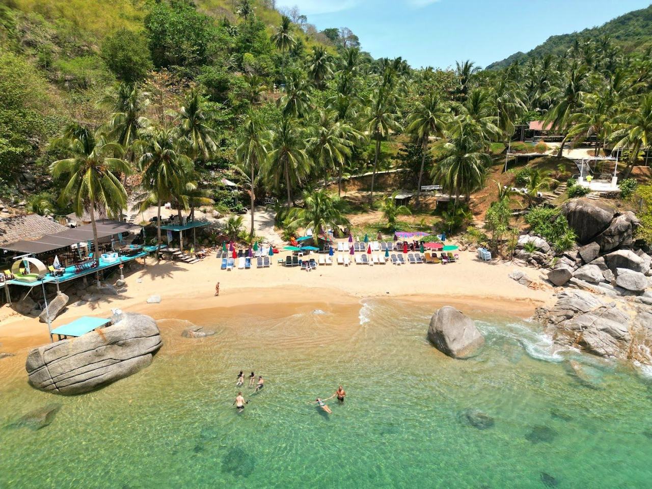 A small rocky cove with clear water at Ya Nui Beach in southern Phuket